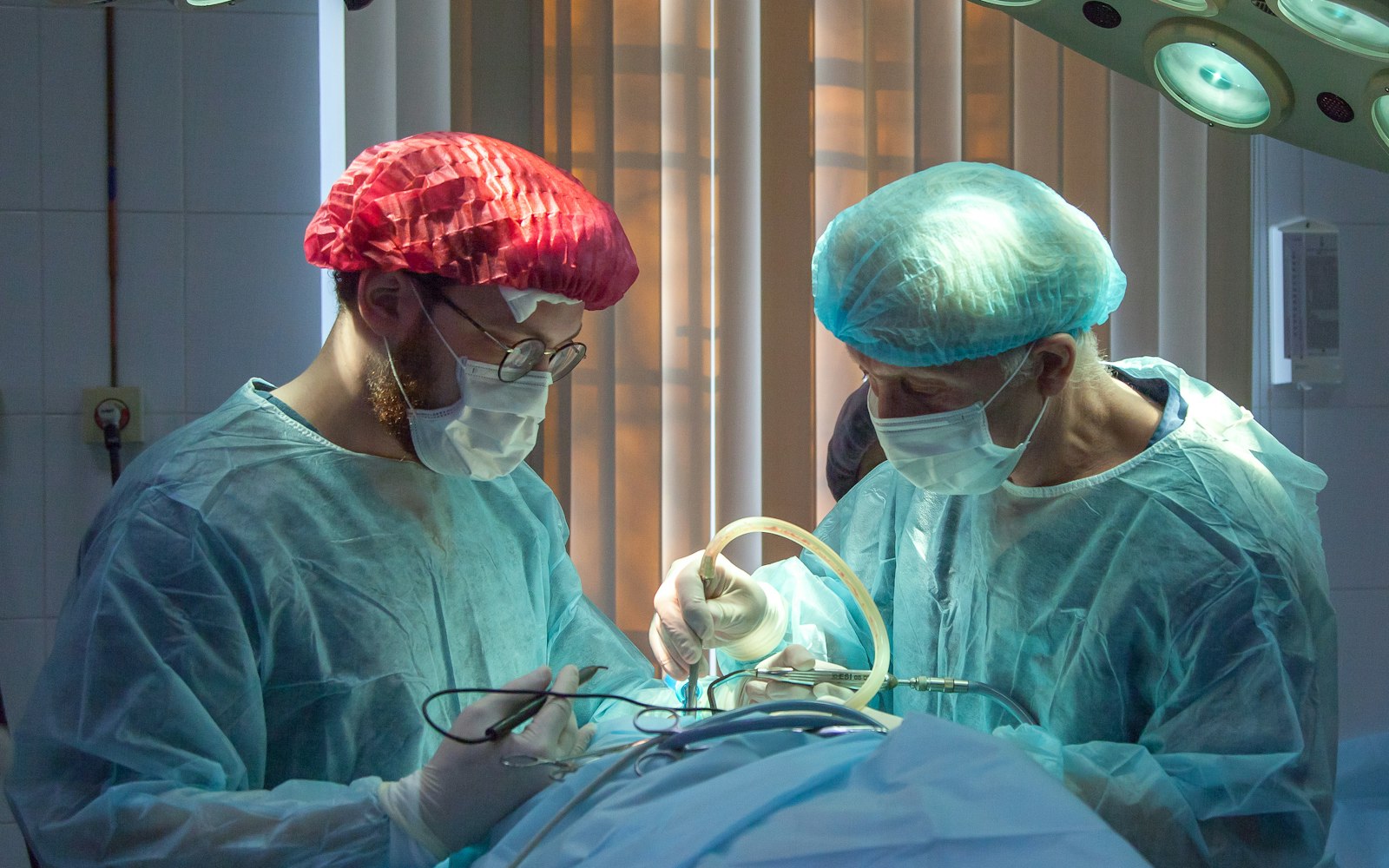 A surgical team at work under operating room lights